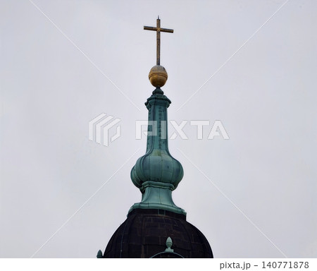 City monument with historic charm. Urban skyline highlight showcasing aged gilded domed structure 140771878