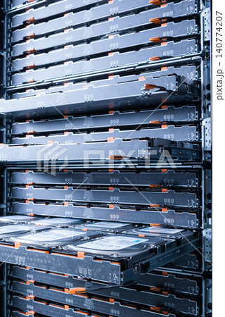 Cluster of hard drives inside open tray Cluster of hard drives inside open tray 140774207