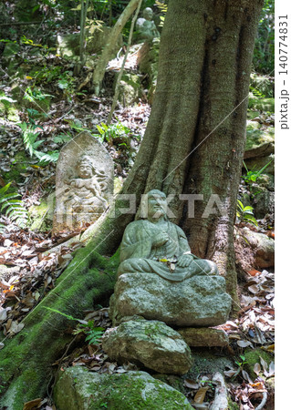 Monk statue in serene Mitaki-Dera temple garden in Hiroshima Monk statue in serene Mitaki-Dera temple garden in Hiroshima 140774831