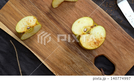Apples on a Table with Cinnamon 140774997