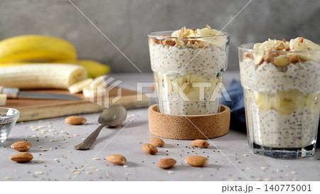 Healthy Chia Seed Pudding with Banana and Sliced Almonds in Glass Healthy Chia Seed Pudding with Banana and Sliced Almonds in Glass 140775001