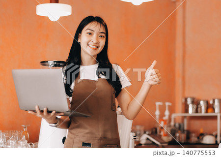 Young woman at barista school learning how to make espresso coffee. Young woman at barista school learning how to make espresso coffee. 140775553