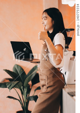 Young woman at barista school learning how to make espresso coffee. Young woman at barista school learning how to make espresso coffee. 140775554