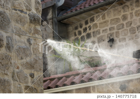 Spraying water with a fog formation system 140775718