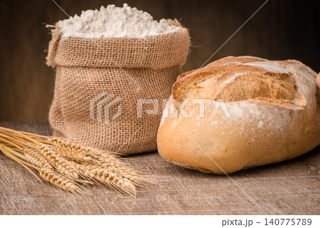 Rustic bread and wheat 140775789