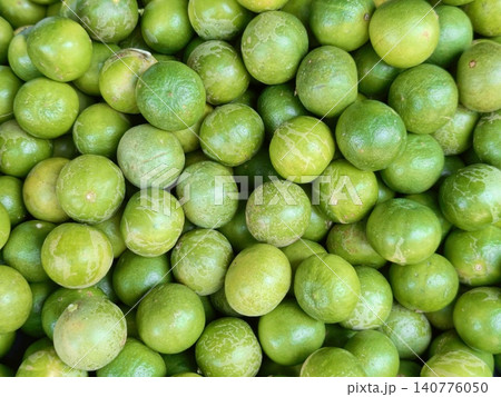 Full frame of fresh green limes texture background Full frame of fresh green limes texture background 140776050