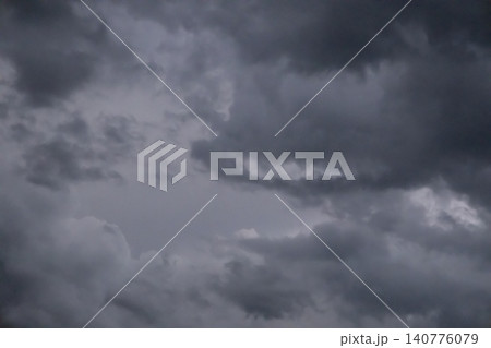 Dramatic dark storm clouds filling the sky, ominous cloudy weather background before rain. Dramatic dark storm clouds filling the sky, ominous cloudy weather background before rain. 140776079