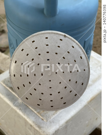 Close Up Of Plastic Watering Can Spout With Perforated Round Head Close Up Of Plastic Watering Can Spout With Perforated Round Head 140776398