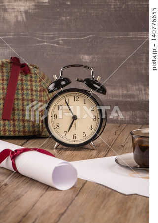Old clock, hat, coffee and paper sheets Old clock, hat, coffee and paper sheets 140776655