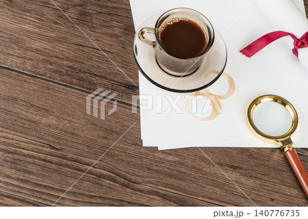 Coffee cup, paper sheets and detective hat 140776735