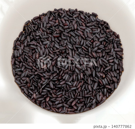 Raw black rice texture Raw black rice texture 140777862
