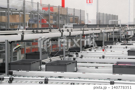 packing line in a logistics warehouse. conveyor belt in a modern production line. Pallet racking 140778351