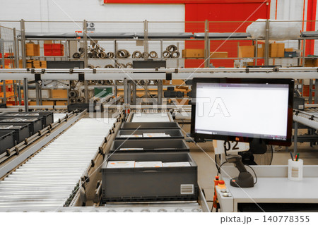 packing line in a logistics warehouse. conveyor belt in a modern production line. Pallet racking 140778355