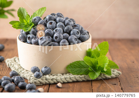 Fresh Blueberries in a Ceramic Bowl Fresh Blueberries in a Ceramic Bowl 140779765