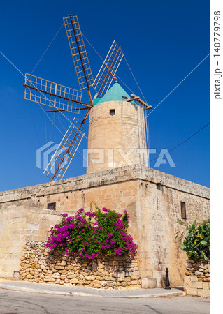 Rural scene of Malta with historic windmill on a sunny day 140779798