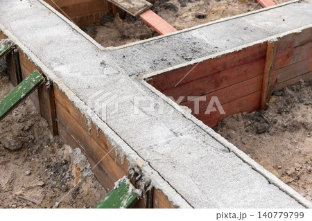 Concrete footing and wooden formwork, new house foundation 140779799