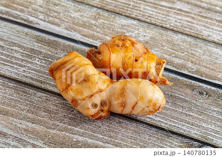 Fresh ginger root on rustic wooden surface 140780135