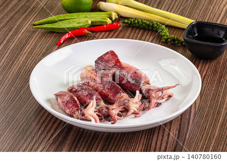 Grilled squid on white plate with fresh ingredients Grilled squid on white plate with fresh ingredients 140780160