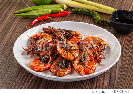 Grilled shrimp on white plate with fresh ingredients 140780161