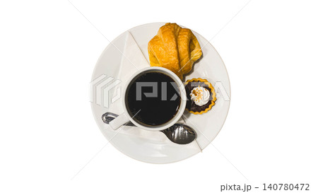 Top view of black coffee cup with croissant and chocolate tart on white plate, isolated on white background. 140780472