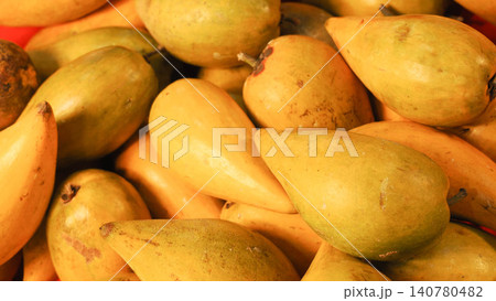 Close-up of fresh canistel fruits pile, ripe yellow eggfruit or yellow sapote background. 140780482