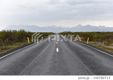 Scenic empty highway leading toward Icelandic mountains Scenic empty highway leading toward Icelandic mountains 140780713