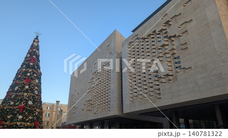 A huge Christmas tree and artistic exterior wall 140781322