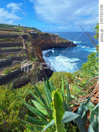 Panoramic view of rocky coastline from banana plantations. Panoramic view of rocky coastline from banana plantations. 140782106