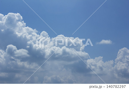 It is a blue sky with fluffy clouds. It is a blue sky with fluffy clouds. 140782297