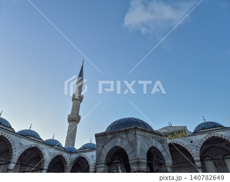 Islamic mosque courtyard with minaret and domes 140782649