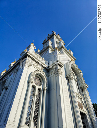 Ornate white church facade against blue sky Ornate white church facade against blue sky 140782701