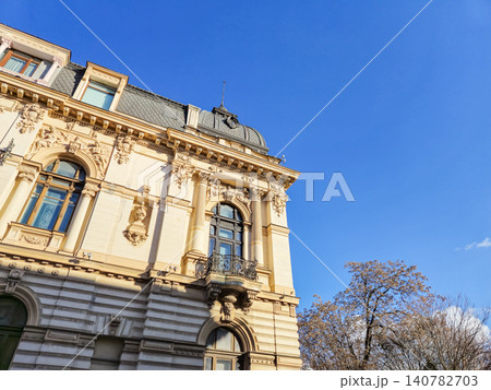 Ornate historic building facade against blue sky Ornate historic building facade against blue sky 140782703