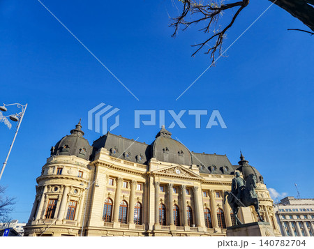 Historic European palace with equestrian statue and blue sky Historic European palace with equestrian statue and blue sky 140782704