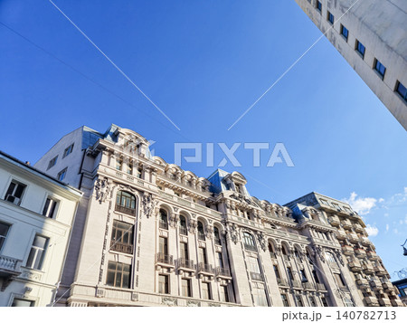 Ornate historic city buildings under clear blue sky 140782713