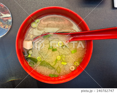 Red Bowl of Miso Soup with Spoon Red Bowl of Miso Soup with Spoon 140782747