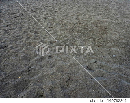 Textured dark sand beach surface Textured dark sand beach surface 140782841