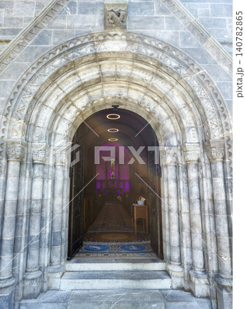 Ornate stone church entrance with arched doorway Ornate stone church entrance with arched doorway 140782865
