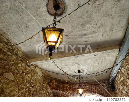 Rustic hanging lanterns with fairy lights indoors Rustic hanging lanterns with fairy lights indoors 140782871