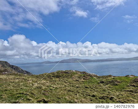 Scenic coastal landscape with blue sea and clouds Scenic coastal landscape with blue sea and clouds 140782976