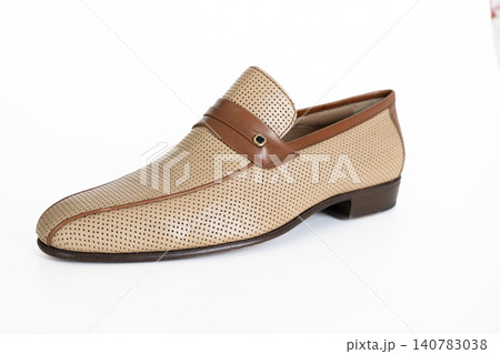 Beige woven leather mens loafer isolated on white background 140783038