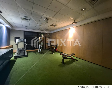 Empty modern gym interior with treadmill and benches Empty modern gym interior with treadmill and benches 140783204