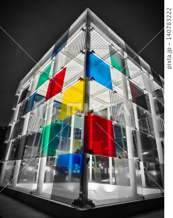Colorful modern glass building at night 140783222