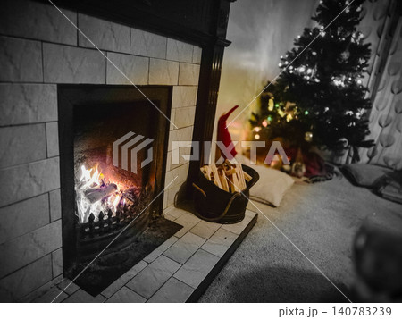 Cozy living room fireplace with Christmas tree Cozy living room fireplace with Christmas tree 140783239