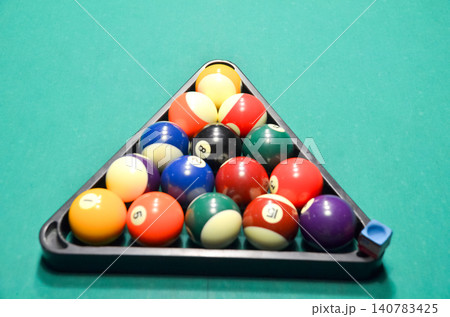 Rack of Billiard Balls on Green Pool Table Rack of Billiard Balls on Green Pool Table 140783425
