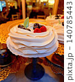 White delicate meringue with cream and berries. 140785443