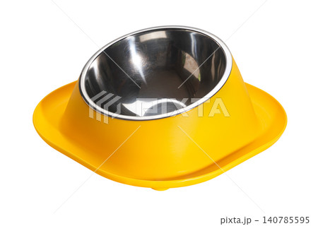 Side view of empty yellow water moat anti ant small dog and cat food bowl. Side view of empty yellow water moat anti ant small dog and cat food bowl. 140785595