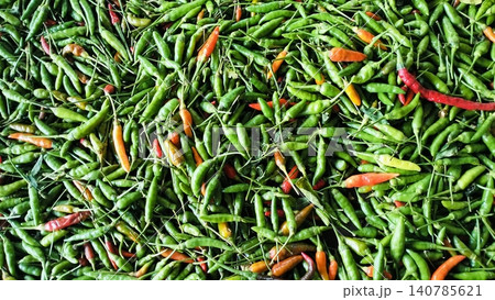 Abundance of Fresh Green Bird's Eye Chilies Background Abundance of Fresh Green Bird's Eye Chilies Background 140785621