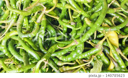 Fresh Organic Long Green Curly Chili Peppers Background 140785623