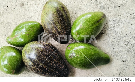 Fresh Whole Green and Ripe Avocados on Concrete Background 140785646
