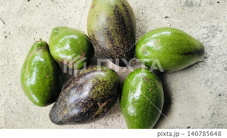 Fresh Whole Green and Ripe Avocados on Concrete Background 140785648